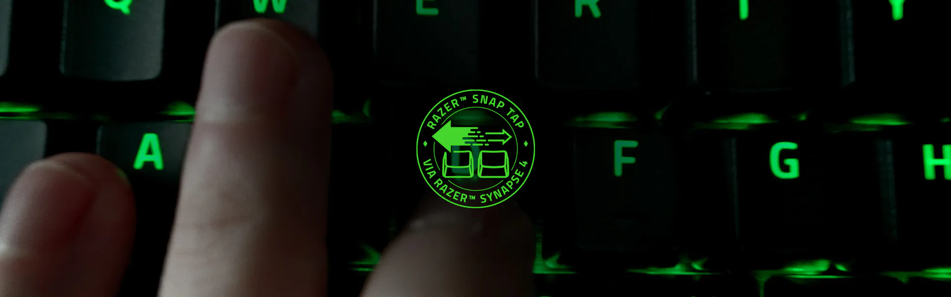 Close crop of a backlit keyboard with the Snap Tap control badge